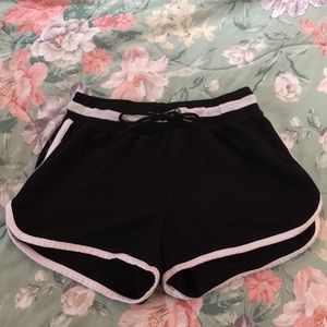 Black shorts with white strips.